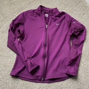 Nike fleece lined jacket with thumb holes.